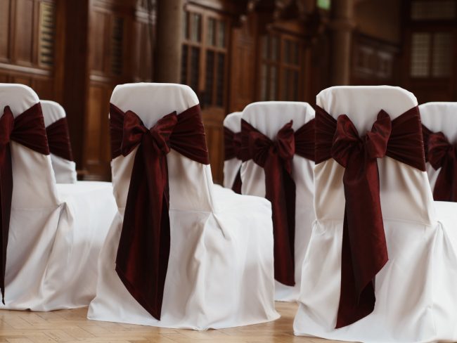 Manchester University Wedding Ceremony White Chair Cover with Burgundy Bows