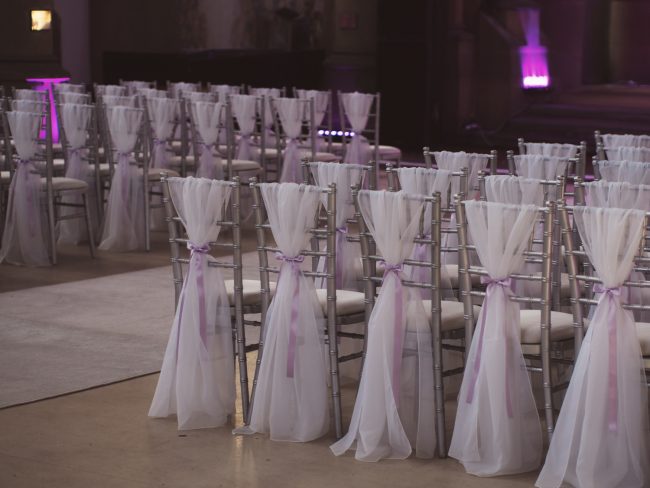 Silver Chiavari Chair Hire Manchester with White Drapes and Lilac Ribbon Bows