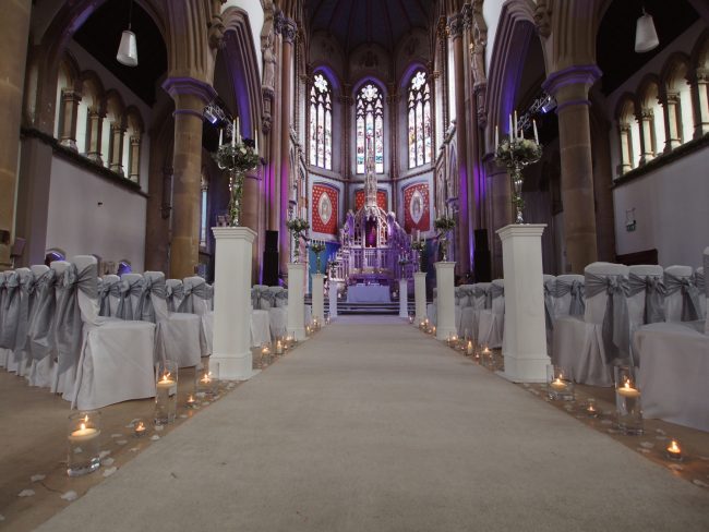 Candle Lined Ceremony Decor Candelabra with LED Candles Silver Sashes & Chair Covers