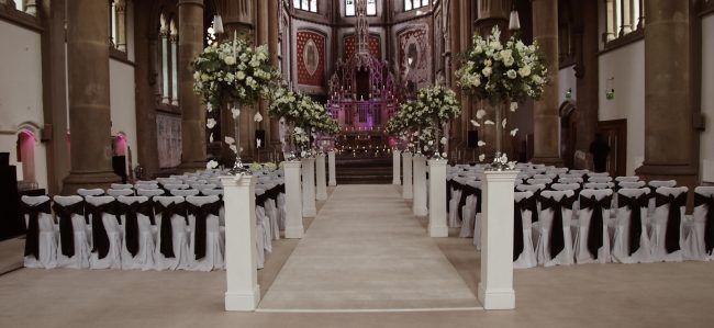 Cream Wedding Carpet & Navy Bows Silver Candelabras with Fresh Flowers