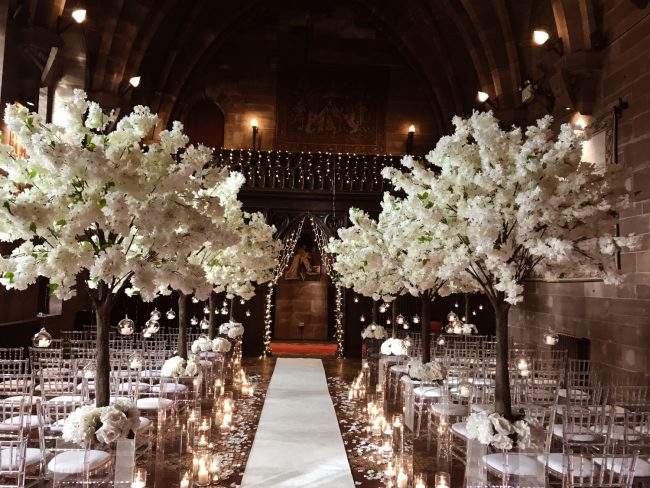 Blossom Trees on Clear Plinths with Candle Lit Aisle