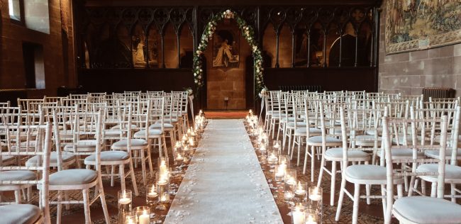 Candle lit Aisle and Chiavari Chair Hire at Peckforton Castle