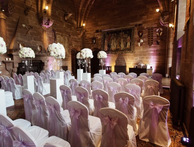 Chair Covers with Lilac Bows and Large Floral Centrepieces