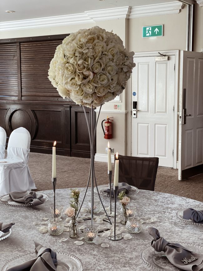 Large Cream Flower Ball Centrepiece with Silver Candlesticks and Flowers